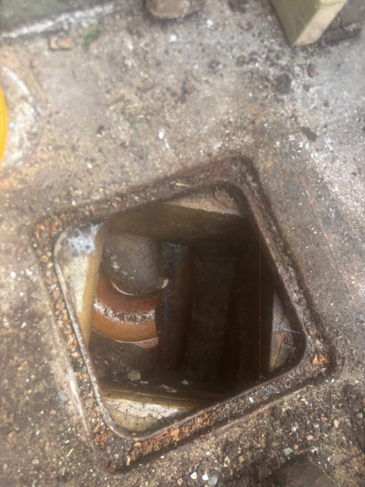 Open sewage drain with flowing water